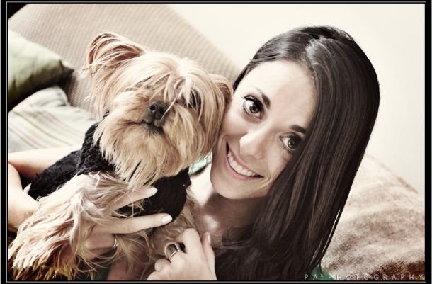 Eliza Orlins posing with her dog, Oscar. 